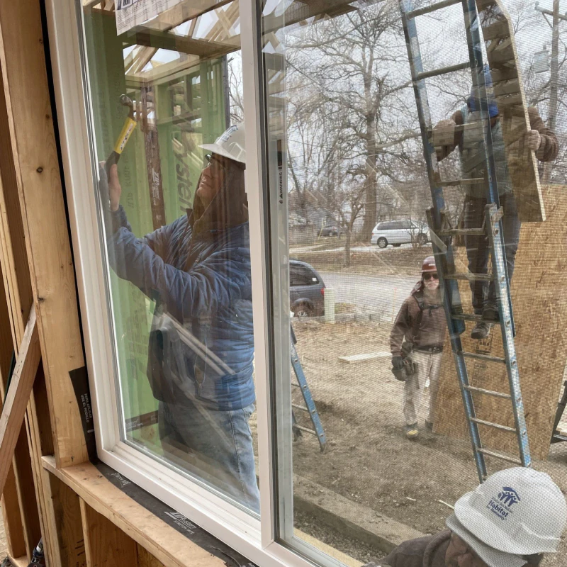 contractor repairing a window